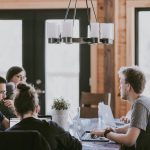 Coworkers sitting together in meeting room