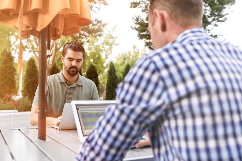 Developers working outside on a sunny day